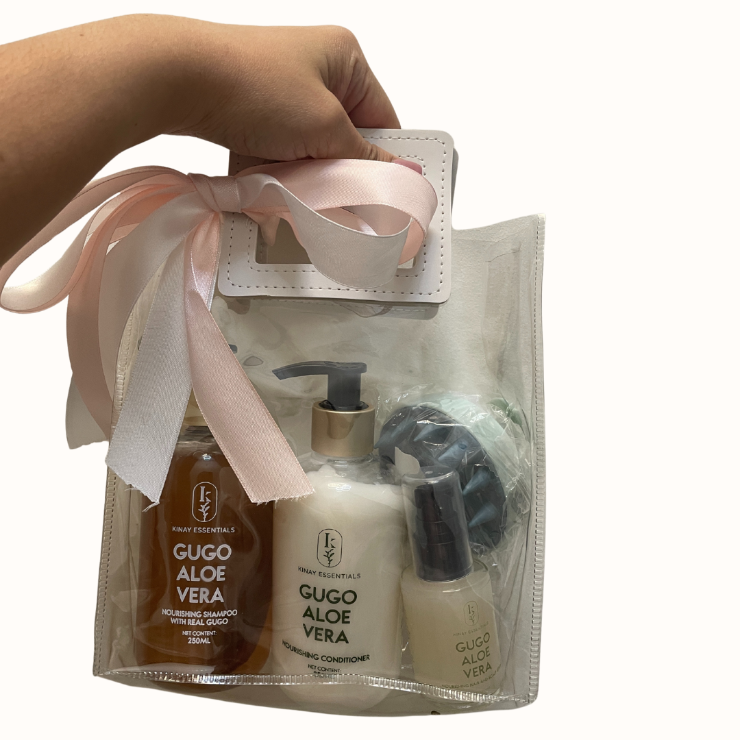Set of Gugo Aloe Vera products in a pouch with a pink ribbon on a white background