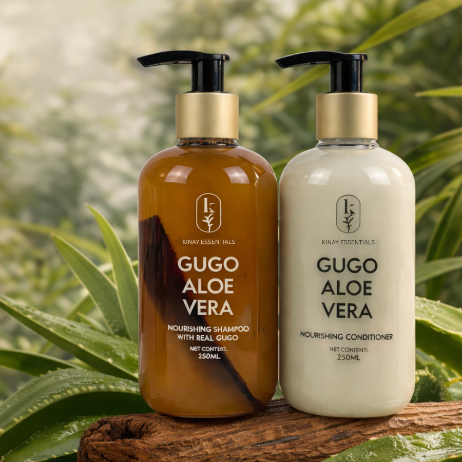 Two bottles of Gugo Aloe Vera shampoo and conditioner on a natural background with green leaves.